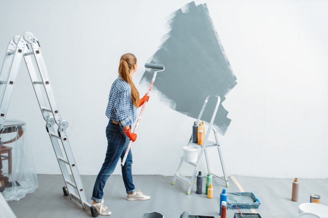 female-house-painter-paints-wall.jpg