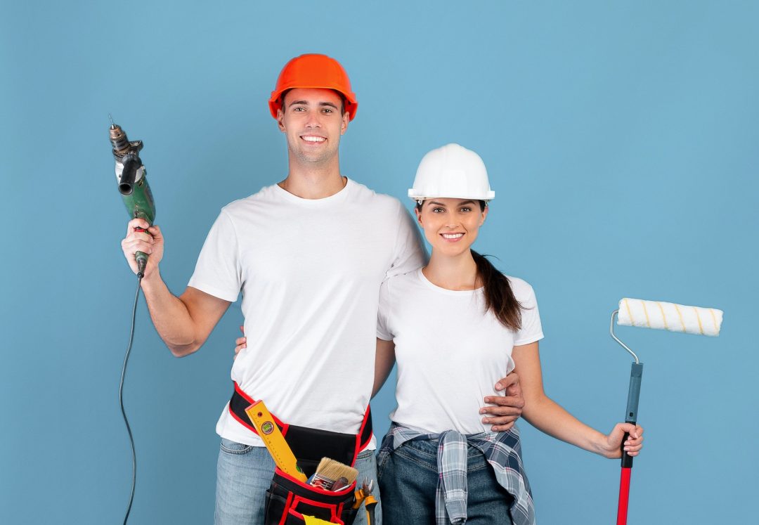house-renovation-smiling-couple-with-drill-and-roller-paint-brush-in-hands.jpg